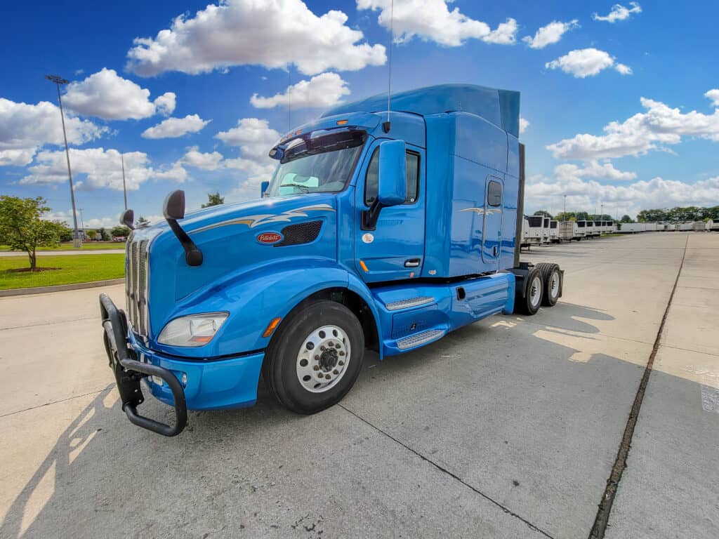 Driver side view of Peterbilt 579 Ultraloft sleeper truck
