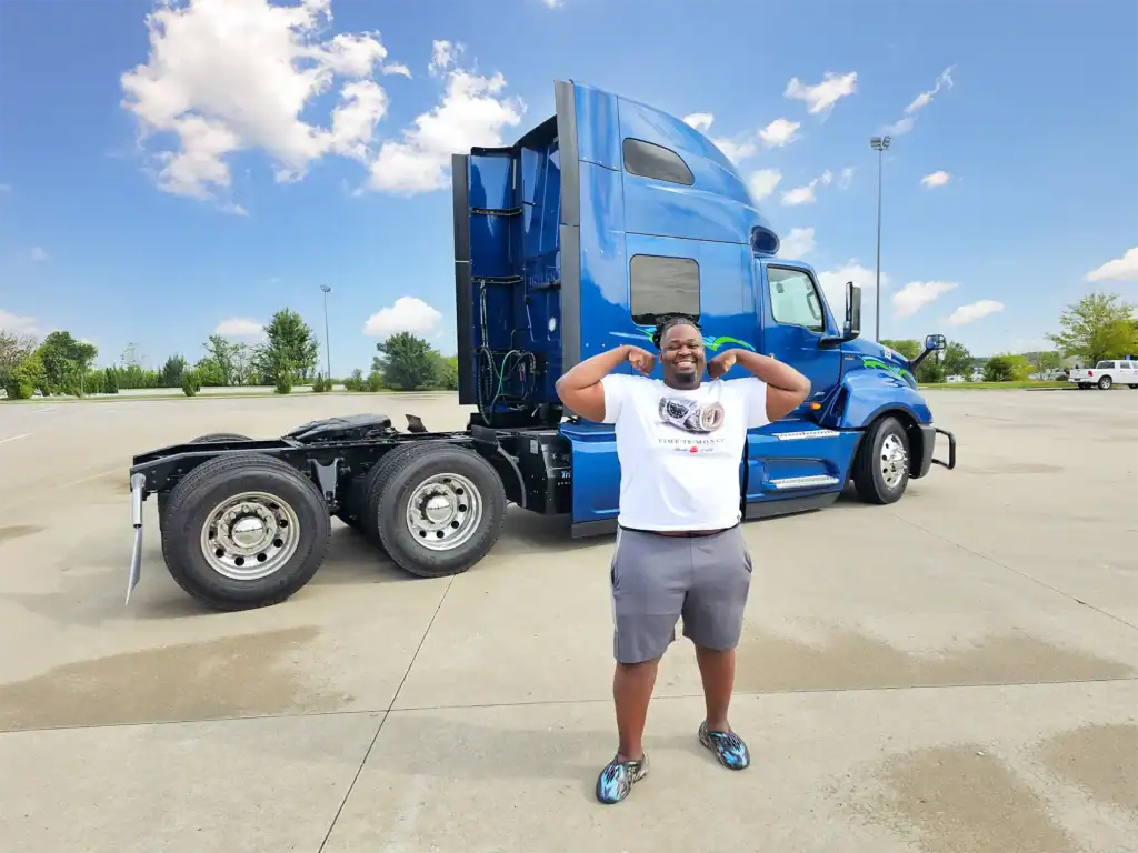 Truck posting in front of a used LT625 International Semi Truck From Pedigree Truck and Trailer